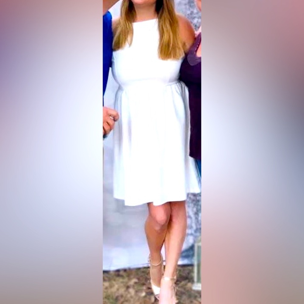 White cocktail dress with pockets. Worn once. Size Lg